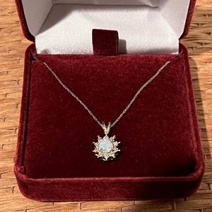 Opal and diamond pendant. Never worn.